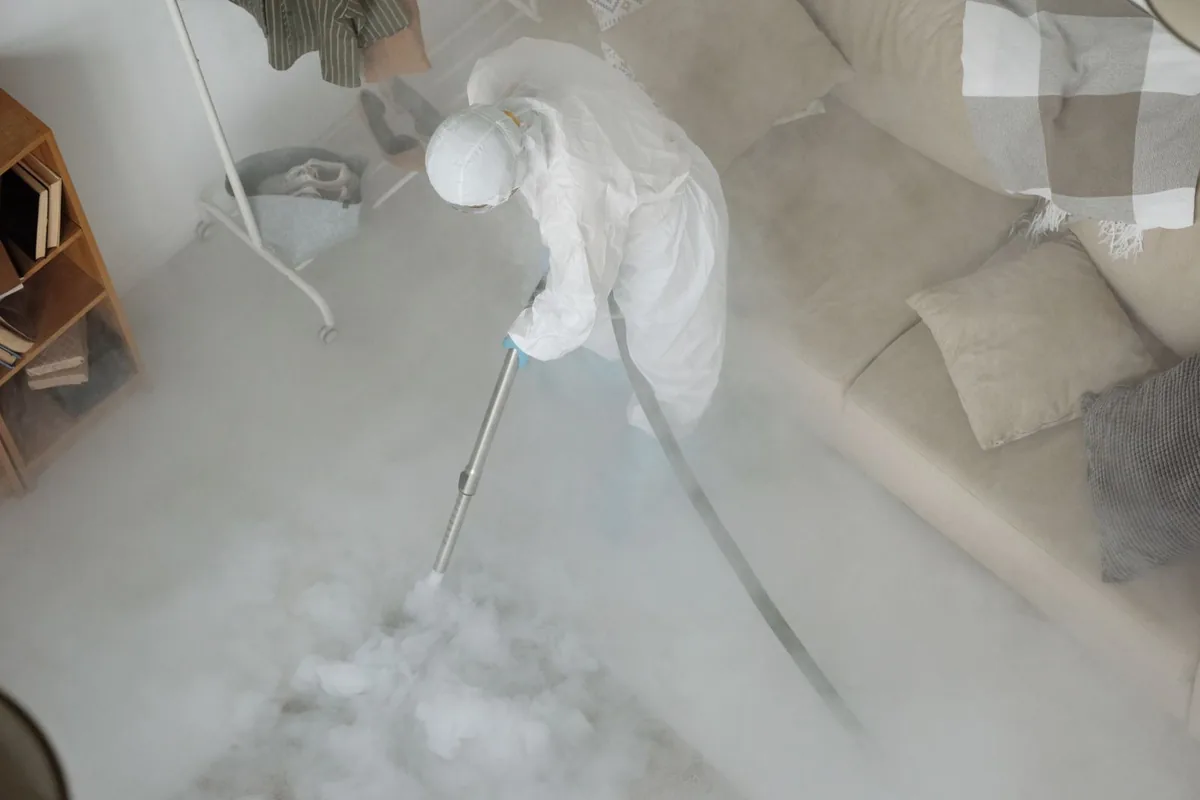 Biohazard cleanup technician in protective equipment, Bridgeport, AL